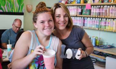 Photo of big pal and little pal making pottery