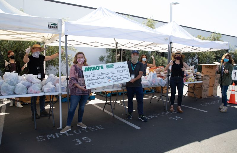 Jimbo's handing a check to JFS from Paper Bag Funds