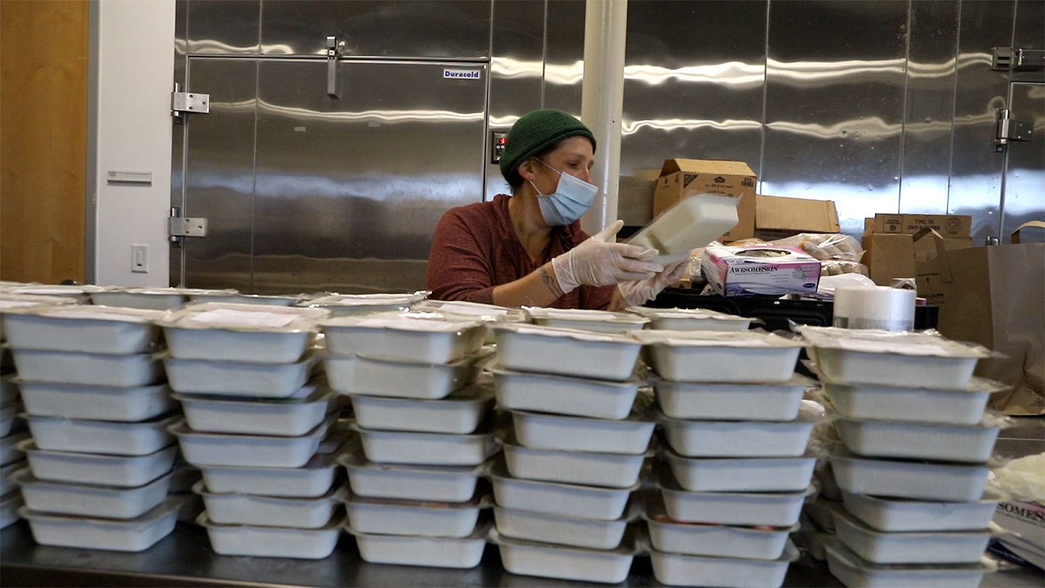 Kjersten sorting frozen Foodmobile meals in our Hand Up Food Pantry warehouse