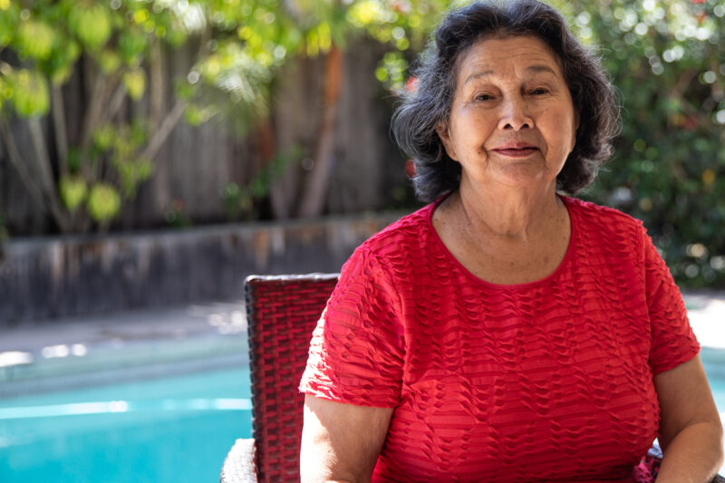 Older adult sitting outside