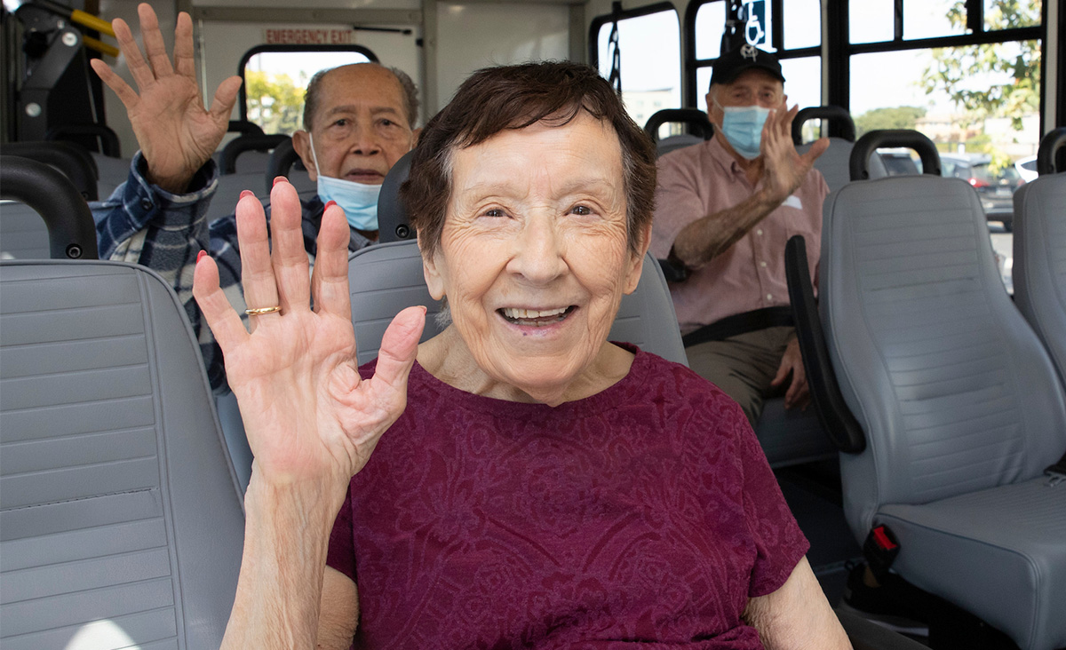 On-the-Go-bus-people-waving